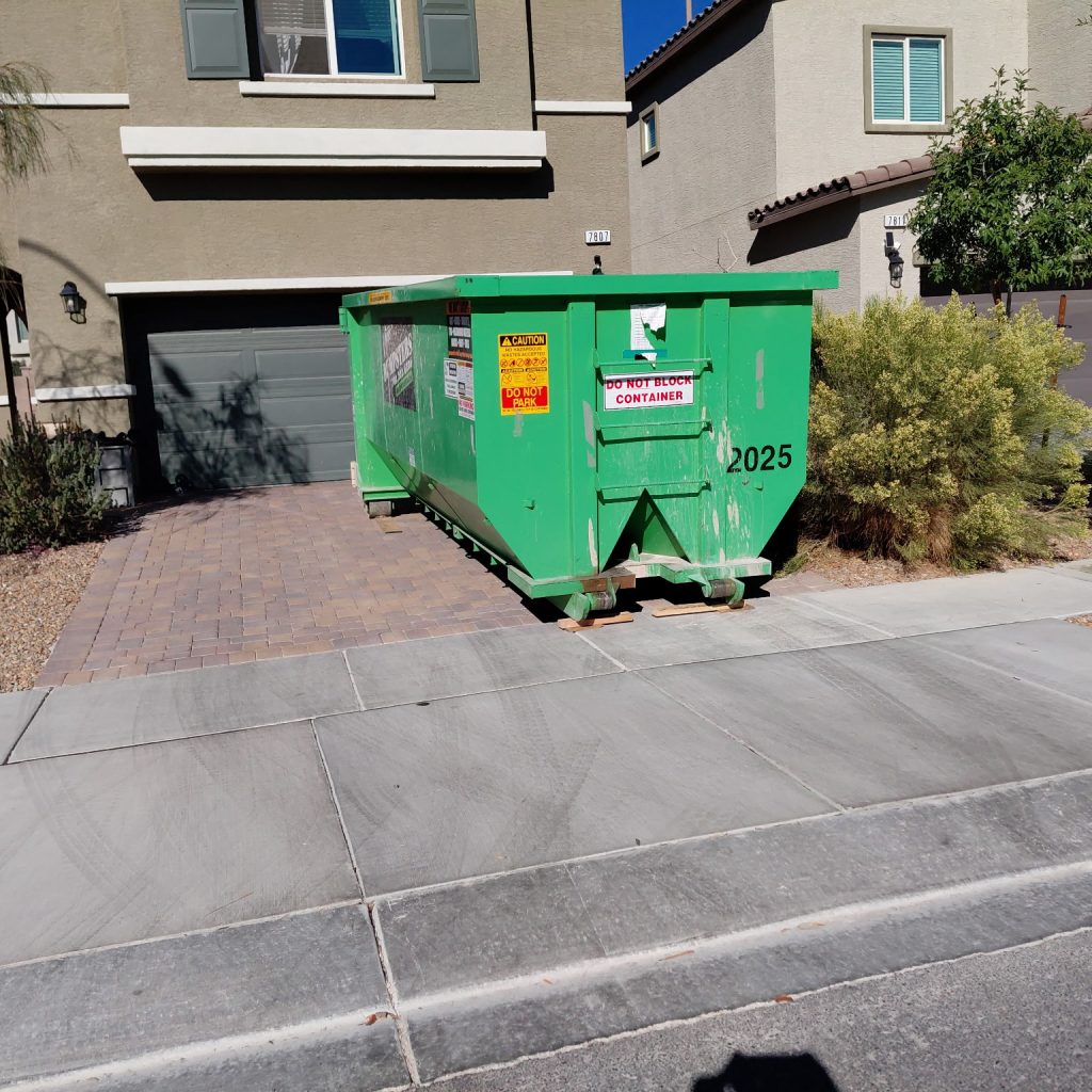 20-Yard dumpster in a driveway for size reference.